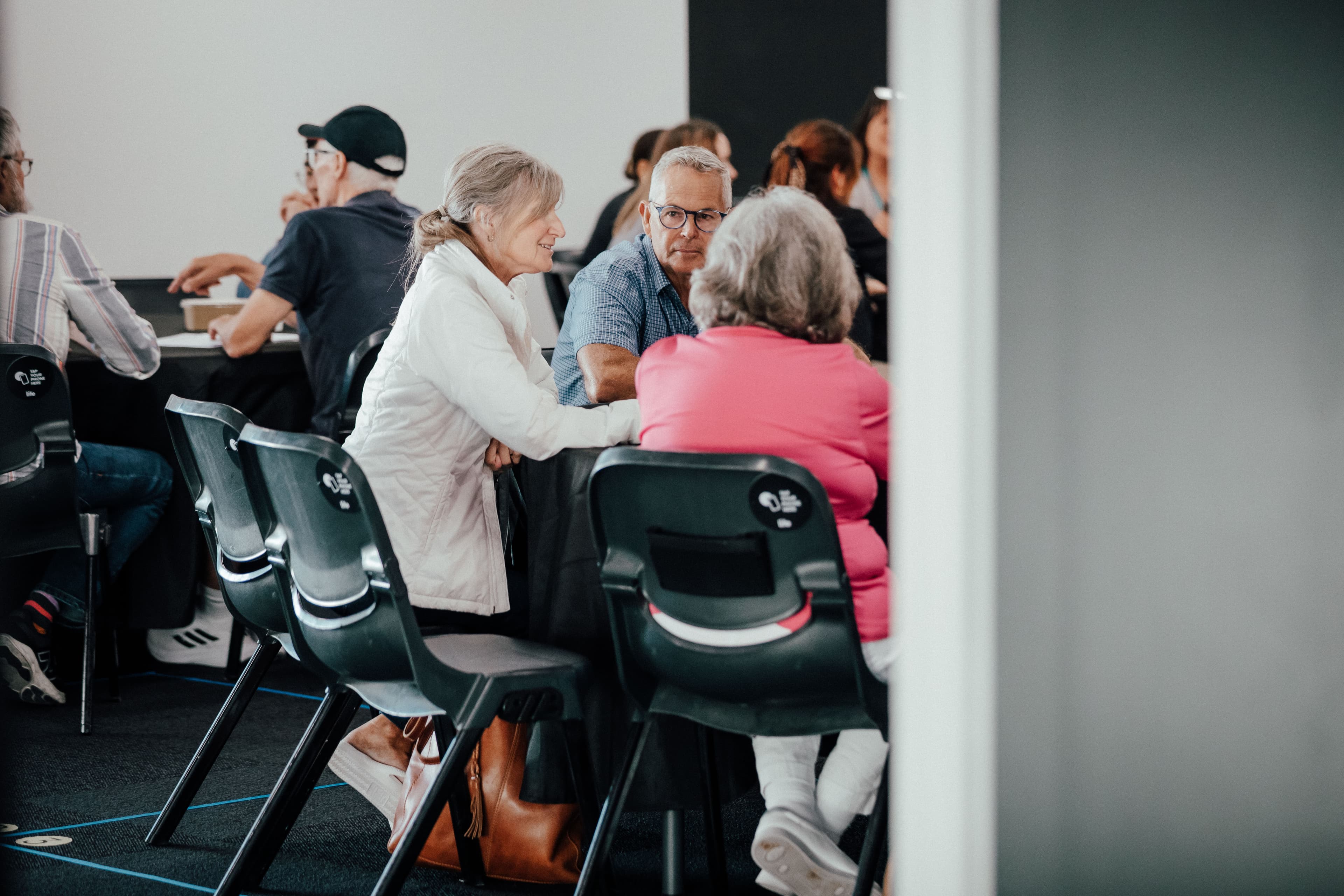 People sitting on chairs at Night School