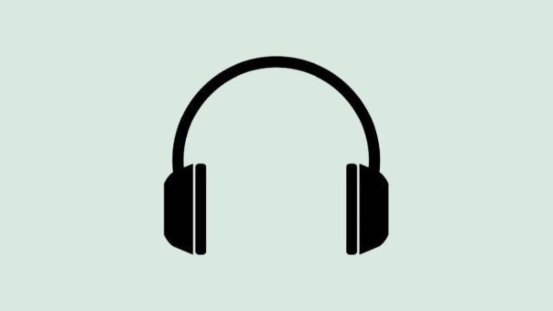 Black headphones icon on pale green background