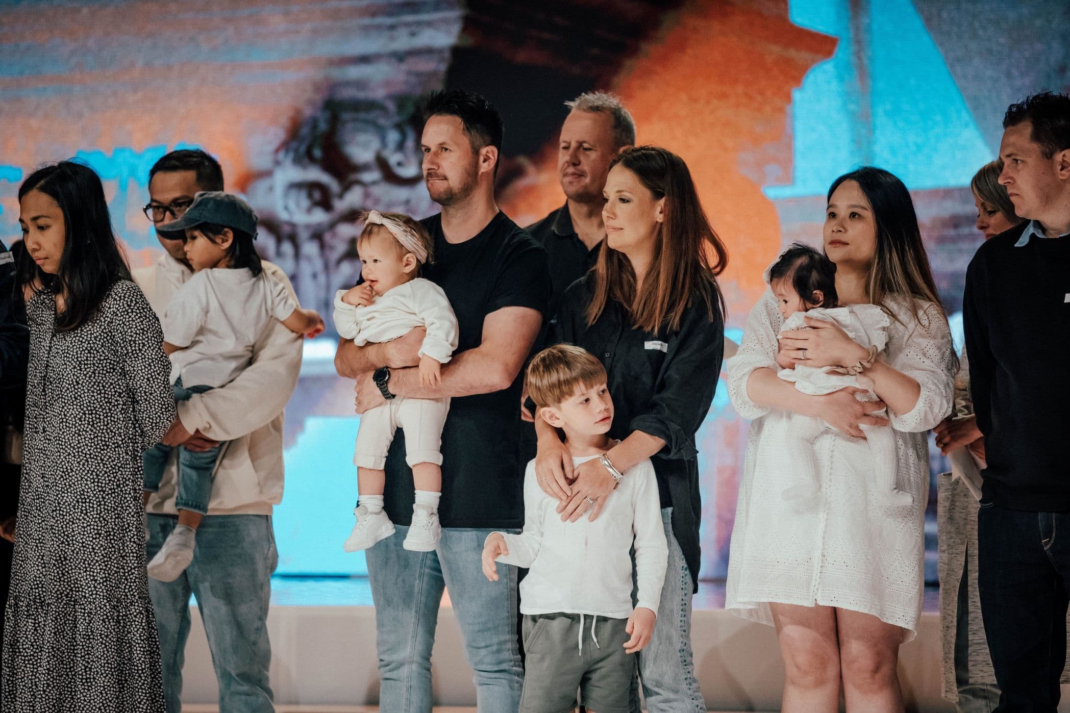 Parents getting their children dedicated.