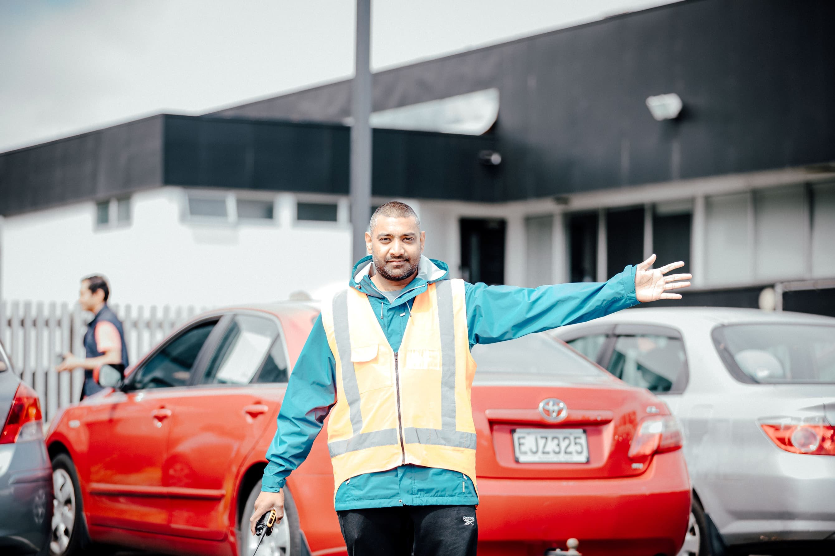 Man guiding cars in the Central campus car park