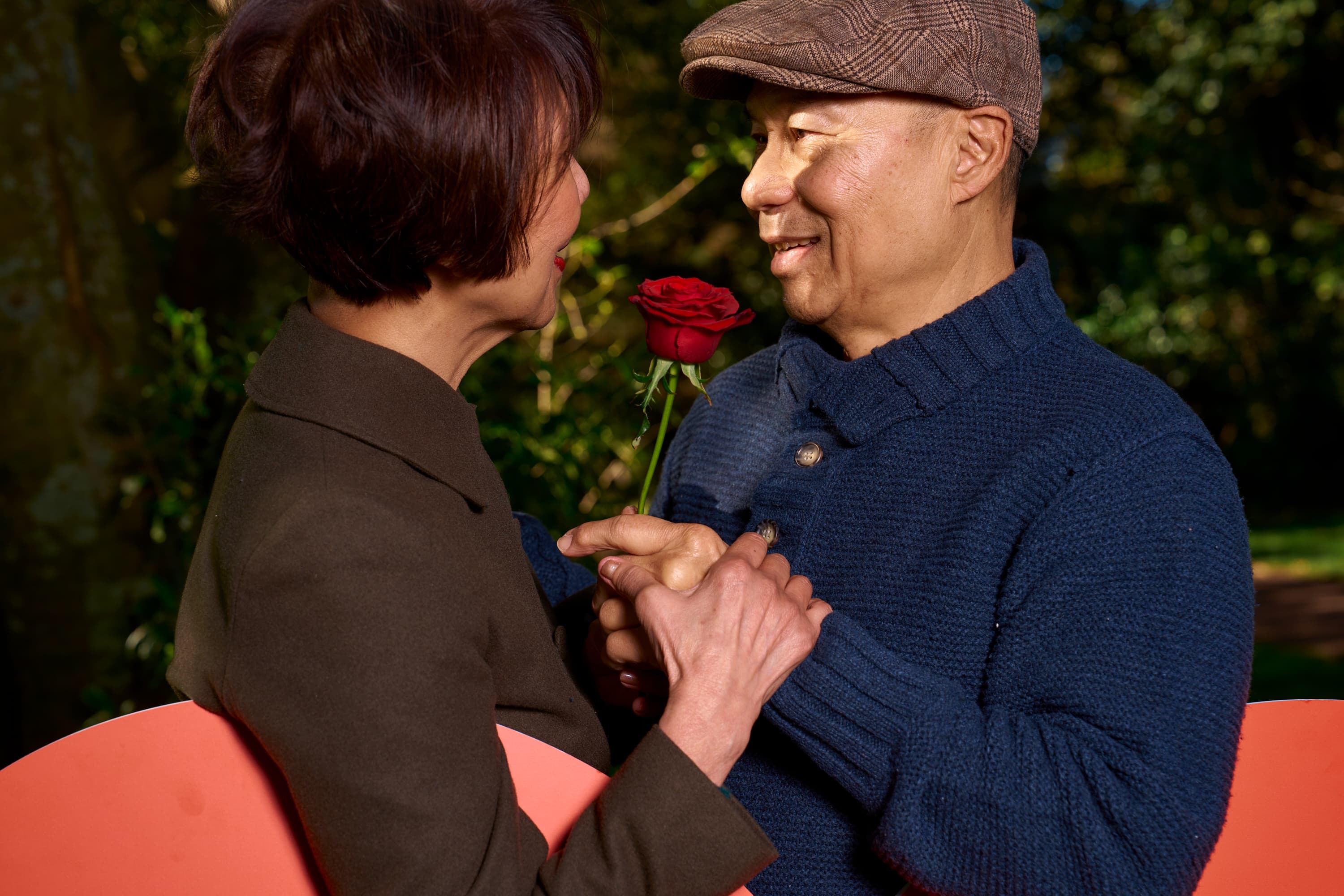 Older couple looking at each other and holding hands